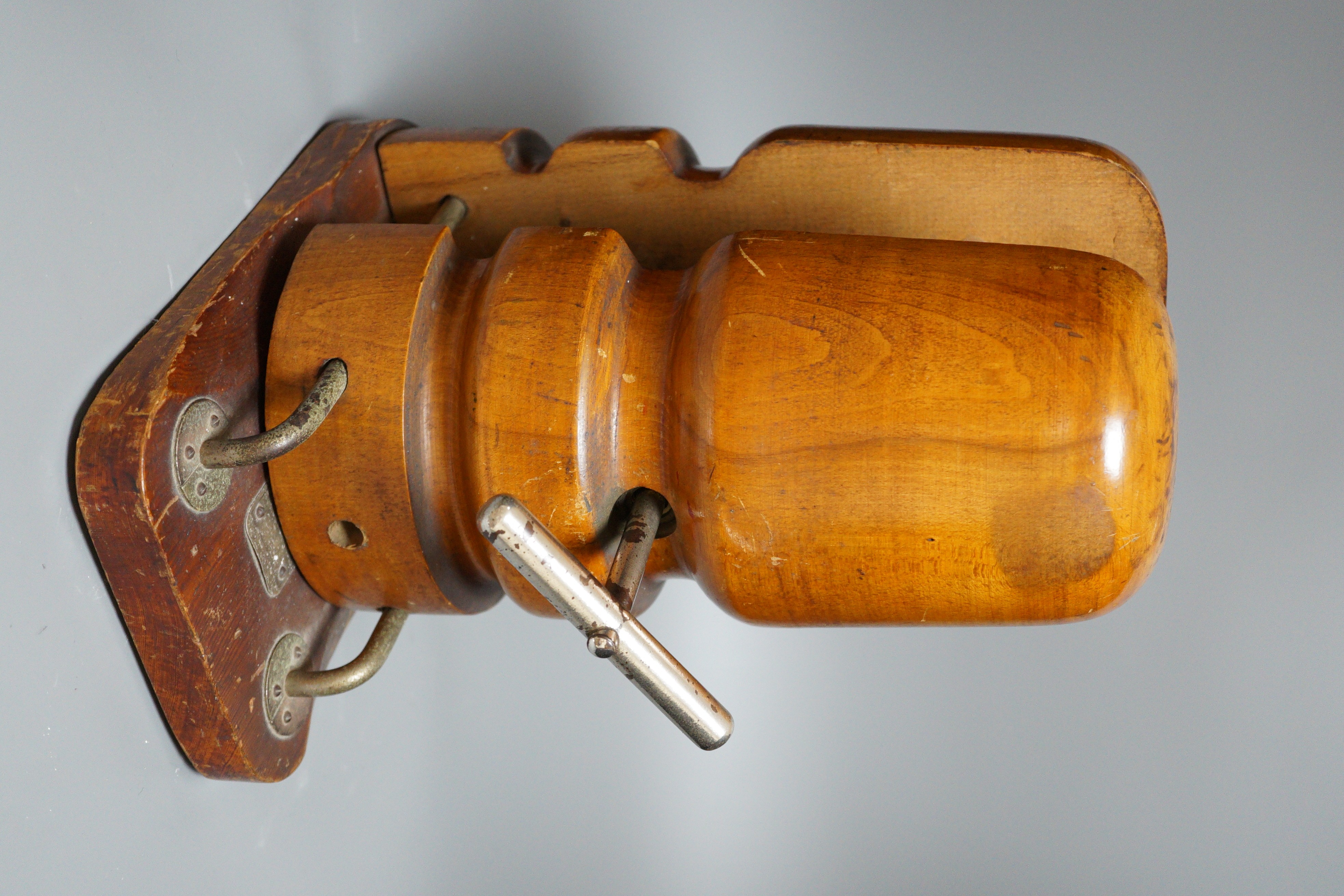 A Vintage turned mahogany hat stretcher